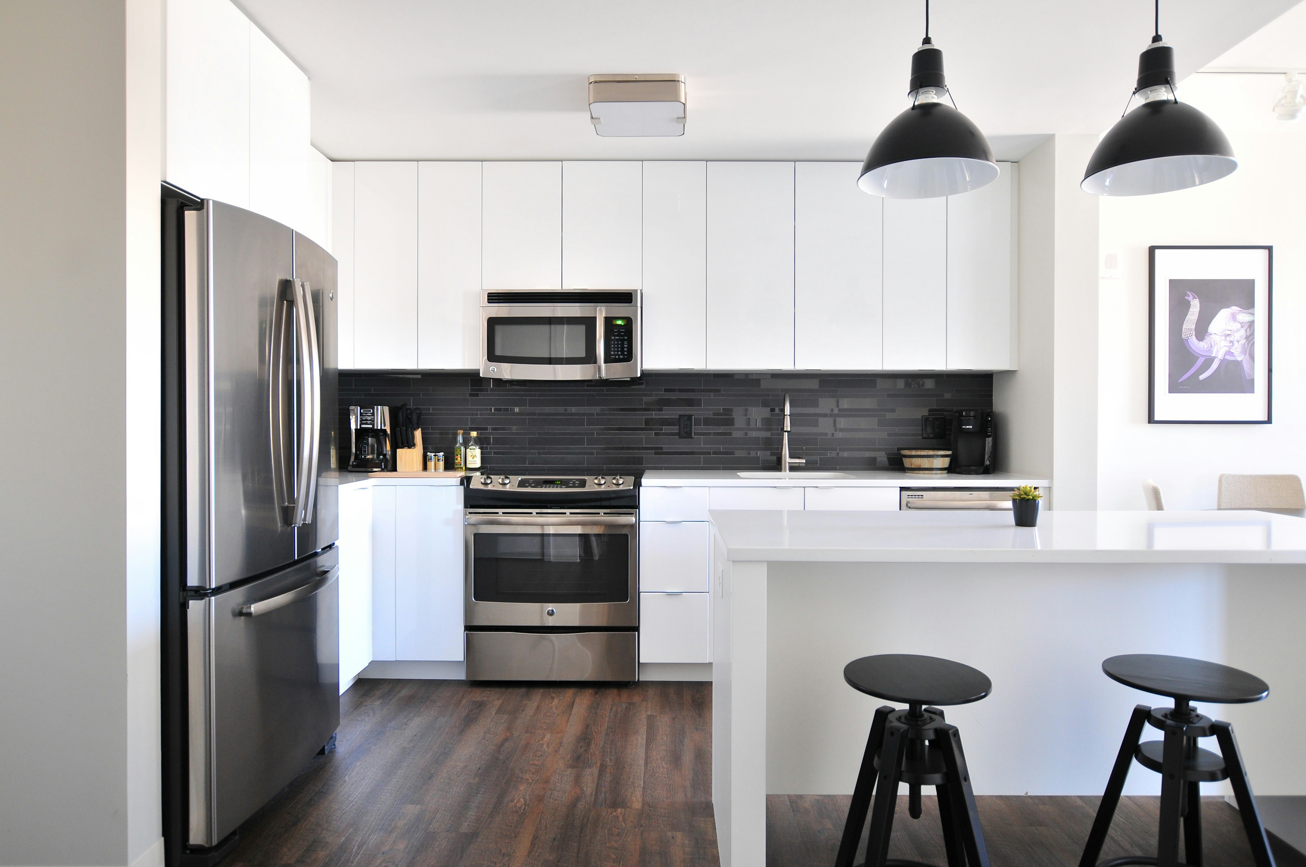 Custom kitchen remodel with white cabinetry
